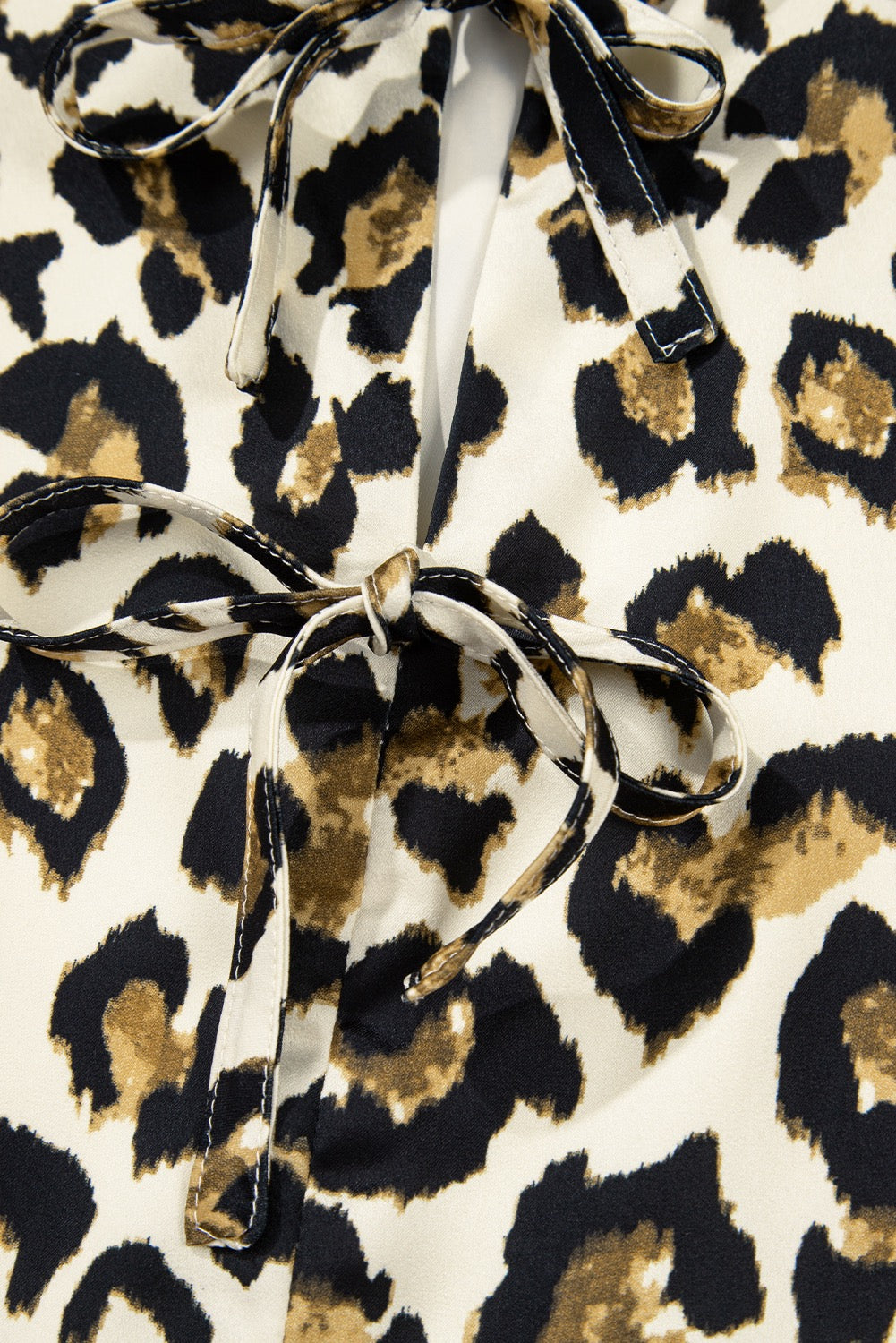 Leopard Tie Front Peplum Top